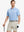 Model wearing Modern Texture Stylish Polo in MISTY BLUE, front half-body view holding golf club.