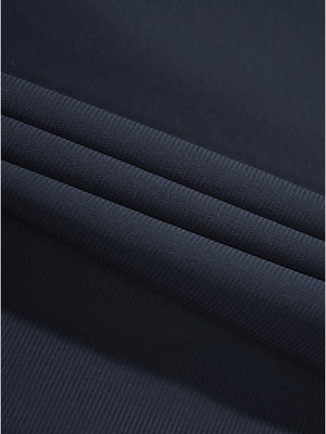 Close-up texture of navy women's regular fit stretchy golf pants fabric showing detailed stretchy material and weave.