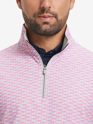 Close-up from nose to chest, showing zipper collar detail and fabric pattern of the pink small fish pullover.