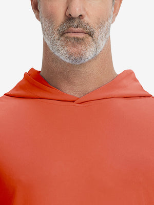 Close-up from nose to chest, showing soft collar texture and stitching detail of the orange hoodie.