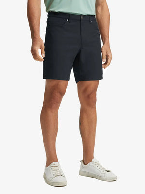 BLACK 4-way Stretch Performance Solid Shorts, golfer front lower body with club, 7 Inch view
