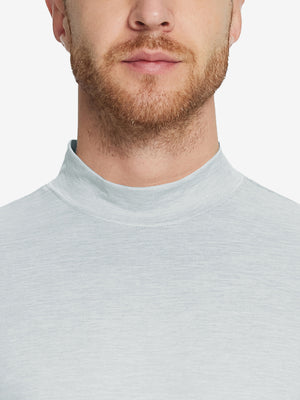 Close-up collar view from nose to chest, showing fine fabric texture of the Light Grey Heather turtleneck.
