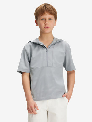 Front waist-up shot of model wearing light grey water-resistant short sleeve q-zip hoodie for boys