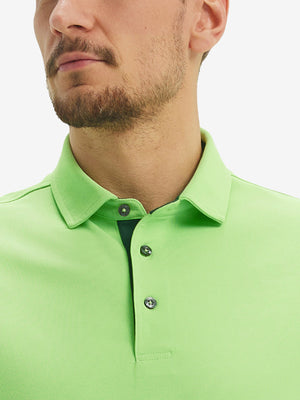 Front view from nose to chest of model wearing the turquoise green ventilated pique performance polo, showcasing the upper fit