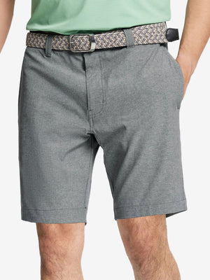 Front view of youth wearing light grey Heather Performance Golf Shorts, showing fit and style