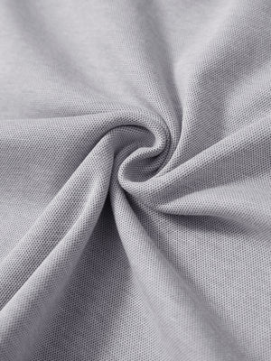 Fabric close-up showing the material of light grey two tone pique cotton blend q-zip.