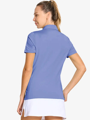Back-side half-body shot of model in HAZE BLUE Women's Performance Solid Polo, looking over shoulder