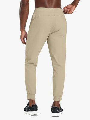 Back lower body view of model wearing KHAKI Performance Tapered Sports Joggers