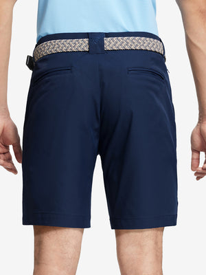 Back waist to knee view of navy water resistant golf 9 inch shorts, flexible performance fit.