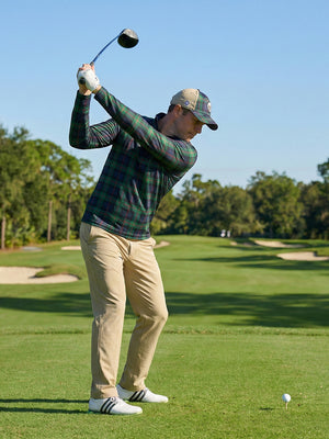 Full print lightweight quarter zip pullover, golfer swinging in dark plaid on open course scene