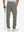 Back lower-body view of lightweight moisture wicking dress pants, model with golf club in dark khaki.