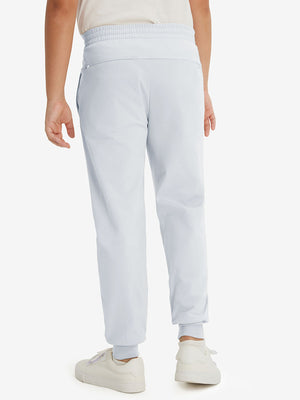 Model's lower body from the back, wearing misty grey fleece stretch water resistant boys joggers.