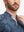 Close-up: nose to chest in dark blue plant stretch printed collarless henley golf shirts