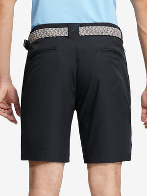 Back waist to knee view of black water resistant golf 9 inch shorts, flexible performance fit.