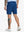 Back lower-body view of model in BLUE INDIGO Water Resistant Versatile 8 Pockets Shorts.