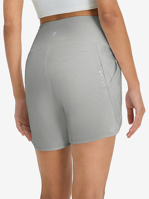 Pantalones cortos de secado rápido 2 en 1 de talle alto para mujer con 7 bolsillos