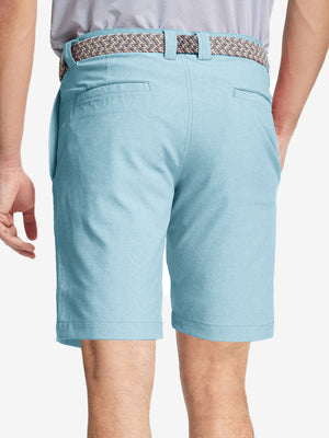 Back view of youth in sky blue Heather Performance Golf Shorts, highlighting rear design and fit