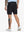 Back lower-body view of model in BLACK Water Resistant Versatile 8 Pockets Shorts.