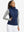 Front upper body of model wearing women's lightweight slim-fit puffer vest, sleek fit in navy