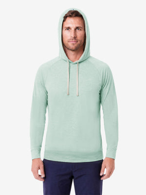 Model front upper body wearing view, heather midlayer golf hoodies in light green heather