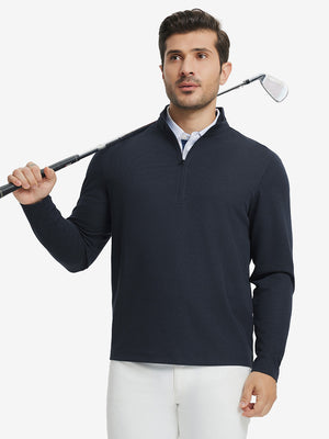 Full body model holding golf club in Premium jacquard quarter zip pullover, navy style