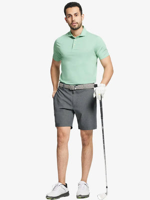 Full body front view of model wearing DARK GREY 7 Inch Heather Performance Golf Shorts, holding a golf club