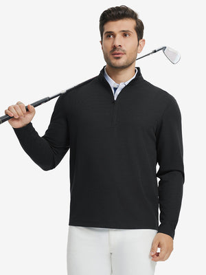 Full body model holding golf club in Premium jacquard quarter zip pullover, black style