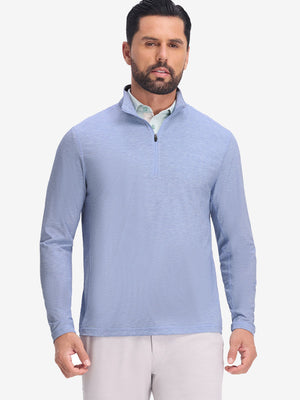Front upper body shot of model wearing light blue featherweight midlayer quarter zip pullover