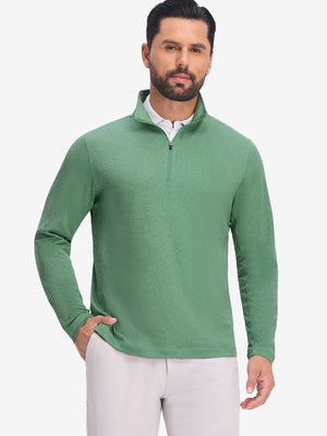 Front upper body shot of model wearing light green featherweight midlayer quarter zip pullover