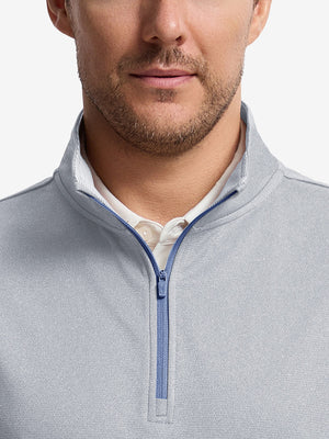 Front shot from nose to chest of model wearing lunar rock melange lightweight sleeveless quarter zip golf vest