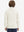 Model in kids soft lightweight fleece lined jacket in beige, showing back half-body view.