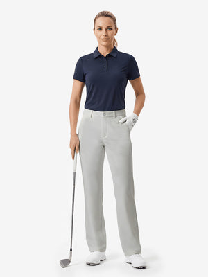 Front full body shot of model with golf gear wearing silver grey women's regular fit stretchy golf pants