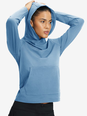 Model holding hoodie cap with both hands, wearing women's lightweight hoodies pullover in misty blue.