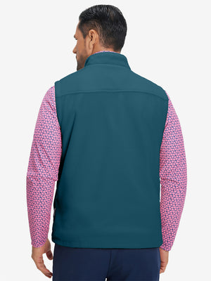 Model's upper body back view wearing dark blue windproof fleece reversible golf vest.