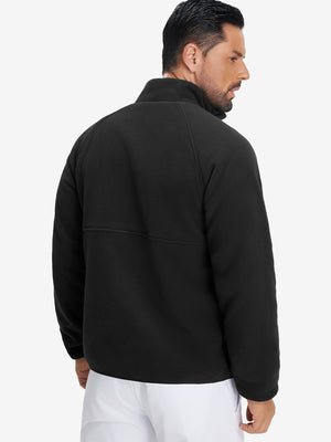 Back view of the model in the reversible fleece jacket with 5 pockets in black.