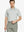 Front half-body shot holding golf club in Grey White Yarn Dyed Stripe Polo – cool and refined