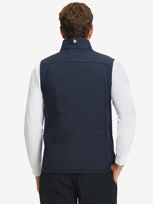 Back view of model wearing Lightweight Water Resistant Puffer Vest in navy