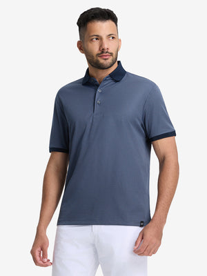Front half-body shot of model wearing the blue quick dry jacquard ribbed collar golf shirt