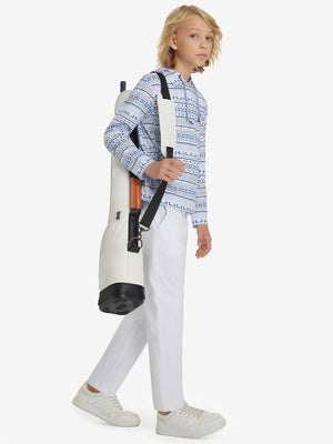 Boys Stretch Fleece Lined Casual Golf Pants in white, model front view carrying tennis bag