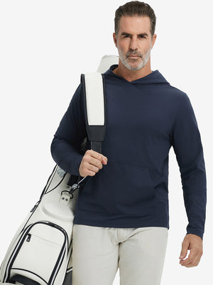 Model carrying golf bag, styled in navy dry fit stretchy sweatshirts hoodie, modern athletic look.