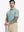 Half-body front view of model holding golf club wearing GREEN HEATHER Premium Stretch Heather Polo.