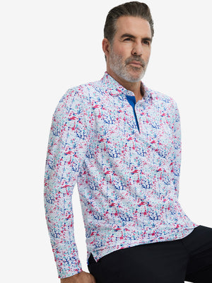 Model sitting in relaxed pose, wearing lightweight print long sleeve polo in white painting, casual and neat.