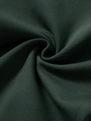 Fabric close-up showing the fleece stretch material of forest green fleece stretch water resistant boys joggers.