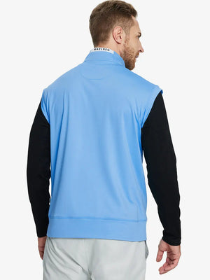 Back half-body view of model in SKY BLUE Stretch Solid Fleece Quarter-Zip Vest.								
