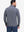 Back upper body shot of model wearing misty blue white grid featherweight midlayer quarter zip pullover