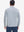 Back upper body shot of model wearing white light blue grid featherweight midlayer quarter zip pullover