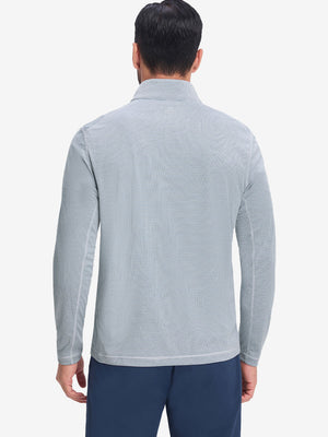 Back upper body shot of model wearing white light blue grid featherweight midlayer quarter zip pullover