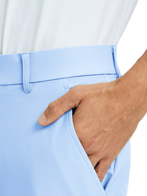 Close-up detail of one hand resting in pocket, showing relaxed fit of the light blue quick dry pants.