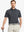Model in DARK GREY STRIPE Golf Polo holding club — dynamic front half-body pose