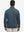 Back upper view of model wearing jacquard quarter zip pullover in black/blue, showing clean seam lines.